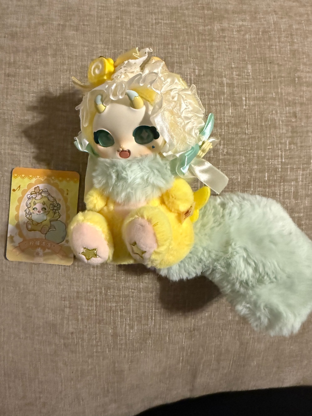 Plush Yellow Star Paw Doll with Aqua Fur